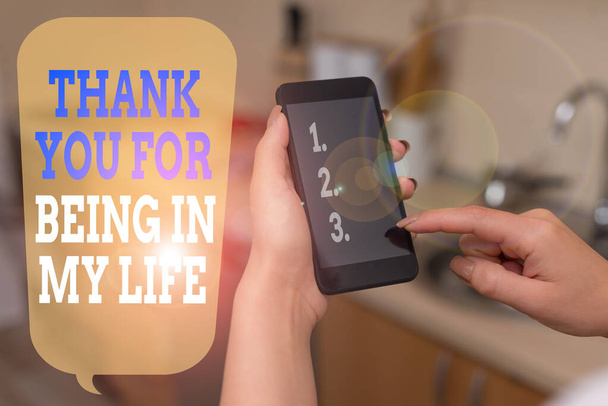 Writing note showing Thank You For Being In My Life. Business photo showcasing loving someone for being by your side woman using smartphone and technological devices inside the home. - Photo, Image