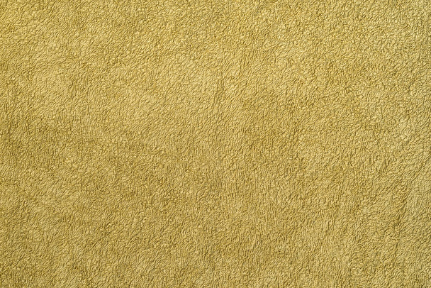 Gladde naadloze textuur van een badhanddoek. Olijfkleur - Foto, afbeelding