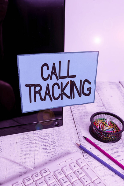 Conceptual hand writing showing Call Tracking. Business photo text Organic search engine Digital advertising Conversion indicator Note paper taped to black screen near keyboard stationary. - Photo, Image