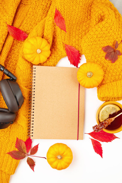 Flat lay autumn composition with fall leaves, hot cup of tea and - Photo, Image