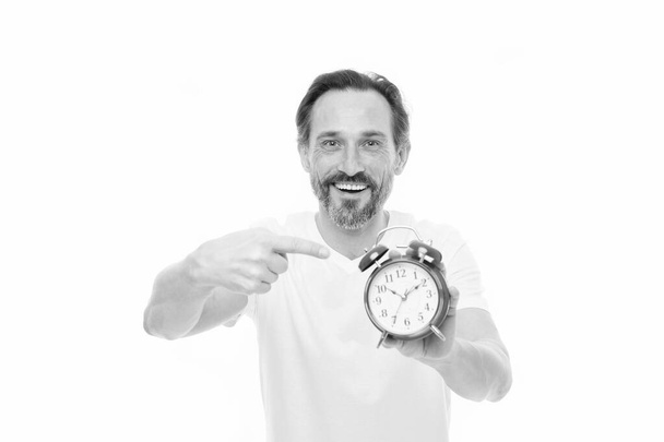 Happy hours. Personal schedule and daily regime. Alarm clock morning time. Time management skills. Man bearded mature guy hold clock isolated on white. Man with beard check what time is it - Foto, immagini