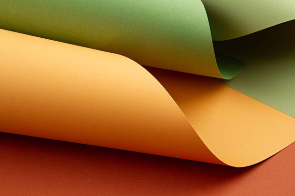 Abstract backgroud of rolled textured paper sheets of different  - Фото, зображення