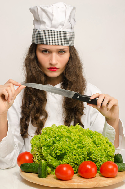 Sexy beautiful chef preparing a green salad for a perfect healthy life - Foto, imagen
