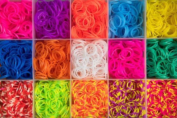 Colourful background of multicolored elastic bands - 写真・画像