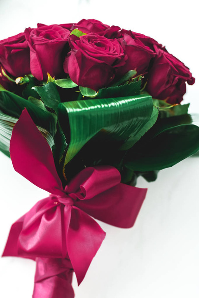 Luxury bouquet of burgundy roses on marble background, beautiful - Φωτογραφία, εικόνα