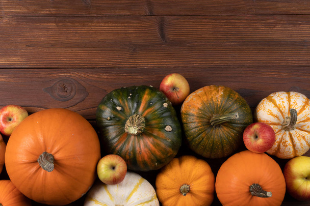 Autumn harvest on wooden table - Фото, изображение