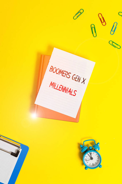 Writing note showing Boomers Gen X Millennials. Business photo showcasing generally considered to be about thirty years Paper clips with blank papers for text messages. - Photo, Image