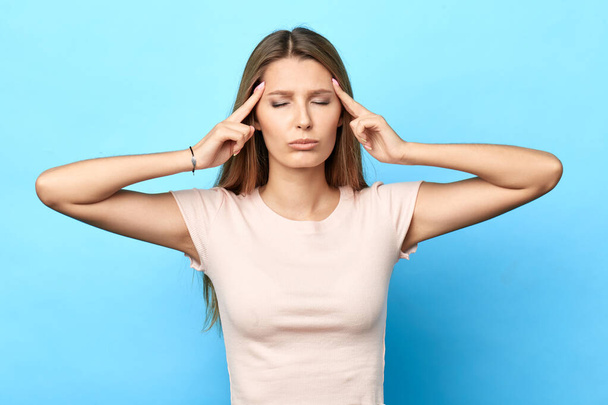 attractive young woman having a headache - Photo, Image
