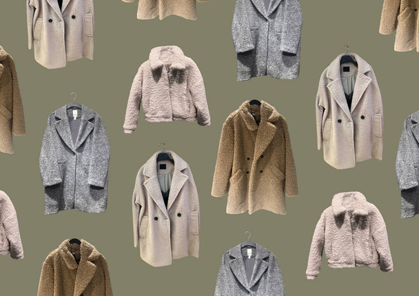 Fashionable winter jacket with fur. Composition of clothes isolated on green. Flat lay, top view, copy space. Ladies' Trench Coat. Winter clothes pattern. Strict classic brown coat. Banner concept - 写真・画像