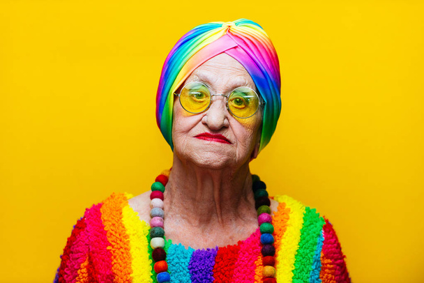 Funny grandmother portraits.granny fashion model on colored back - Photo, image