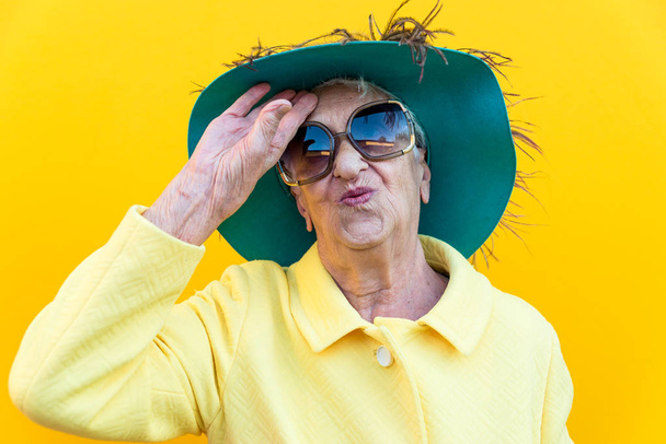 Funny grandmother portraits. Senior old woman dressing elegant f - Фото, изображение
