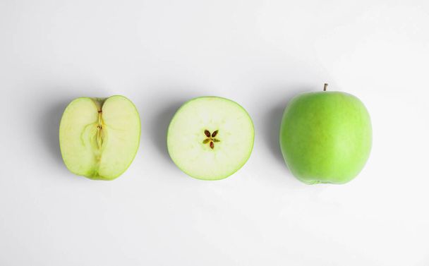 Fresh ripe green apples on white background, top view - Photo, image