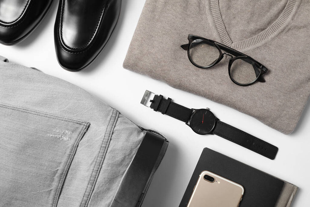 Stylish male autumn outfit and accessories on white background, flat lay. Trendy warm clothes - Fotoğraf, Görsel