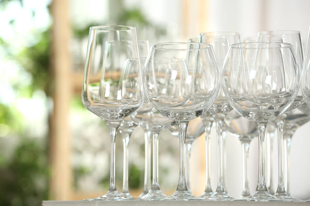 Empty glasses on table against blurred background - Foto, immagini