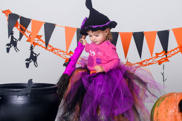 Little girl on Halloween, decor for the holiday. - Zdjęcie, obraz