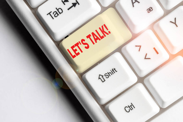 Conceptual hand writing showing Let S Talk. Business photo text they are suggesting beginning conversation on specific topic White pc keyboard with note paper above the white background. - Photo, Image