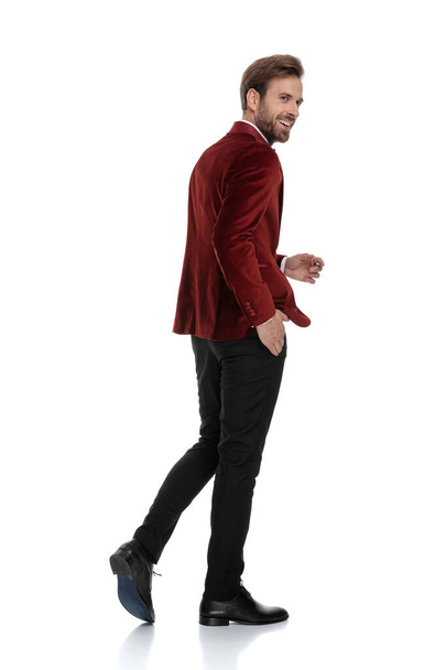 happy young fashion man wearing red velvet tuxedo - Φωτογραφία, εικόνα
