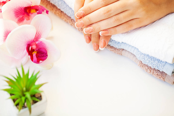 Nails care. Beautiful womans nails with french manicure, in beauty studio - Foto, imagen