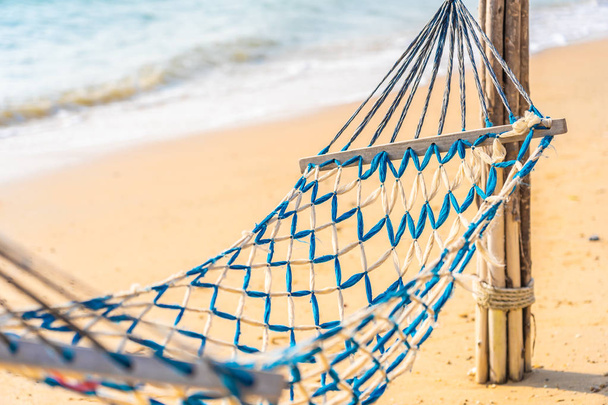 Empty hammock swing on the beautiful beach and sea - Photo, Image