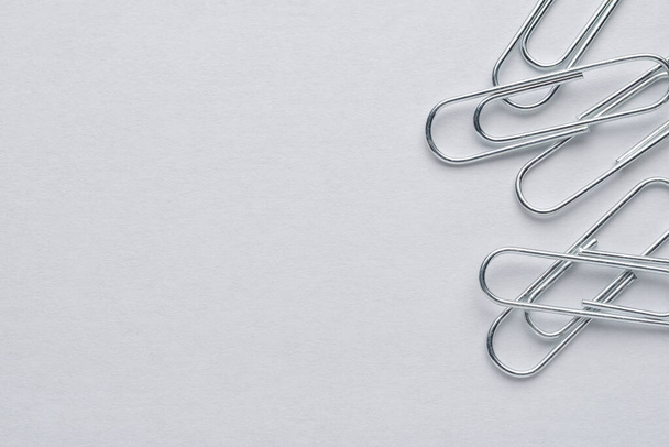 Metal paper clips on white background with copy space - Photo, Image