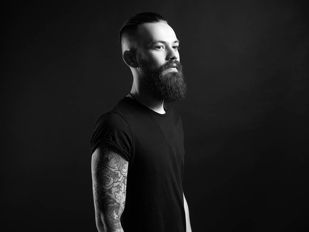 Boy with stylish haircut and tattoo. black and white portrait - Photo, Image