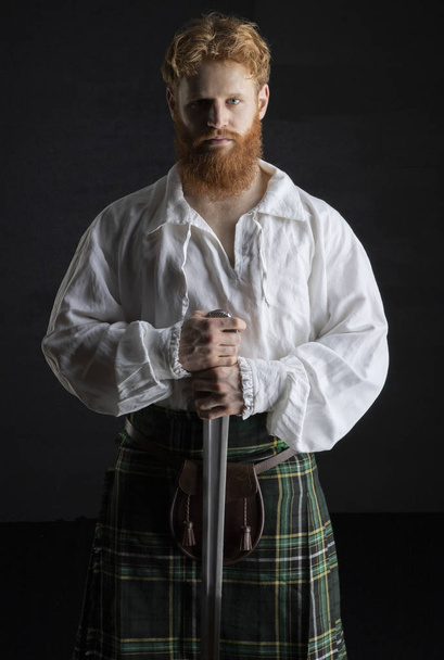 Young Scottish man with red hair and a beard - Fotó, kép
