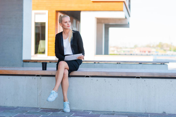 Outdoor photo of young and attractive businesswoman or student. Business and education concept. - Fotografie, Obrázek