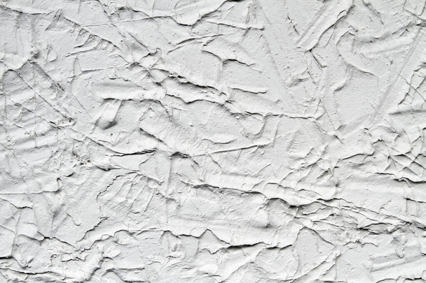 Декоративно-серый гипсовый эффект на стену. Текстура штукатурки. Крупный план
 - Фото, изображение
