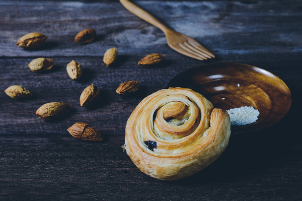 Bread Denis with Chocolate chips with almond on wood background. - Φωτογραφία, εικόνα