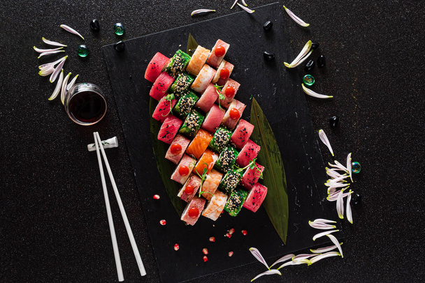 delicious sushi on the black background - Фото, изображение