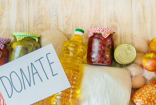 Food and plate with text for donation. Selective focus. - 写真・画像