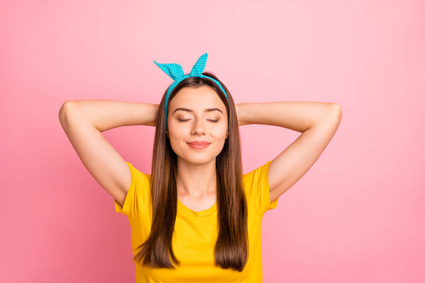 Top above angle photo of lovely youth with closed eyes lying wearing yellow t-shirt isolated over pink background - Φωτογραφία, εικόνα
