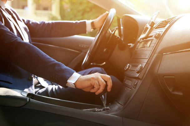 Successful businessman driving modern car - Photo, Image