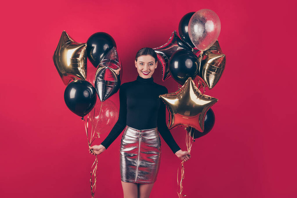 Portrait of her she nice-looking attractive pretty charming cute fascinating cheerful cheery lady holding in hands air balls festive day isolated on maroon burgundy marsala red pastel color background - Foto, immagini