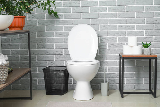 Modern toilet bowl in interior of restroom - Φωτογραφία, εικόνα