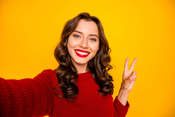 Self photo of cheerful charming cute nice pretty sweet girlfriend showing you v-sign taking selfie isolated over yellow vivid color background - Foto, Imagem