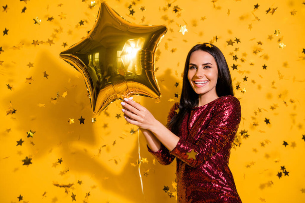Close-up portrait of her she nice-looking attractive lovely gorgeous fascinating cheerful girl holding in hands air ball celebratory isolated on bright vivid shine vibrant yellow color background - Фото, зображення