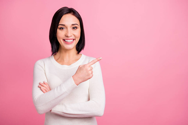 Photo of amazing business lady indicating finger to empty space on sale shopping prices wear white pullover isolated pink bright color background - 写真・画像