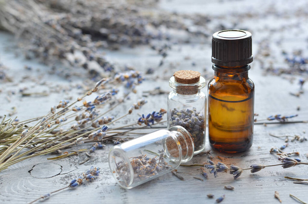 lavender essential oil with lavender on wooden background - Zdjęcie, obraz