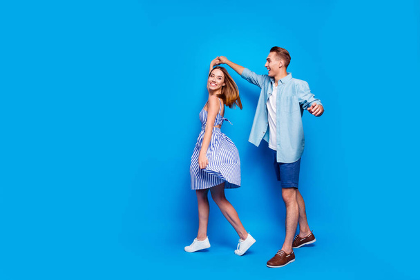Full length body size view of her she his he two nice attractive charming lovely cheerful partners dancing spinning waltz isolated over bright vivid shine vibrant blue turquoise color background - Fotoğraf, Görsel