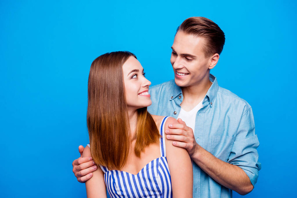 Close-up portrait of his he her she two nice attractive charming cute lovely sweet cheerful cheery people hugging communicating isolated over bright vivid shine vibrant blue turquoise color background - Valokuva, kuva