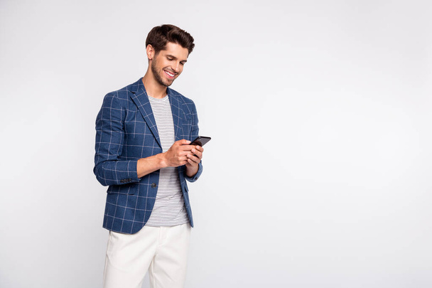 Portrait of his he nice attractive lovely stylish cheerful cheery freelancer HR director wearing blue checked blazer using gadget device chatting isolated over light white pastel background - Fotografie, Obrázek