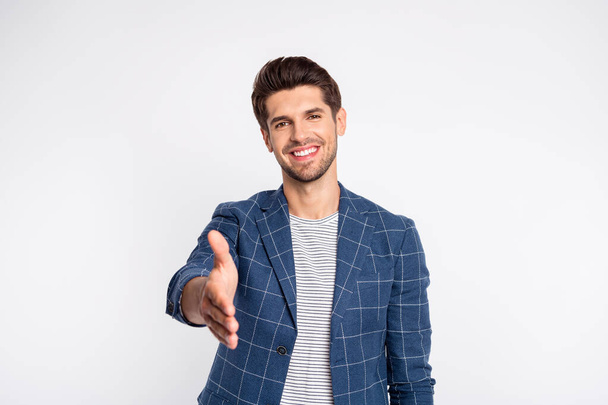 Portrait of cheerful man shake hand greet person wear checkered plaid look blazer jacket isolated white background - Foto, afbeelding