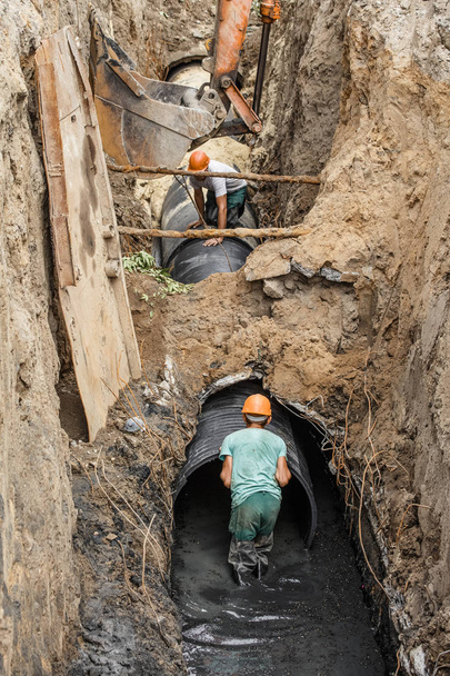 replacement of a sewer pipe deep under the ground - Photo, Image