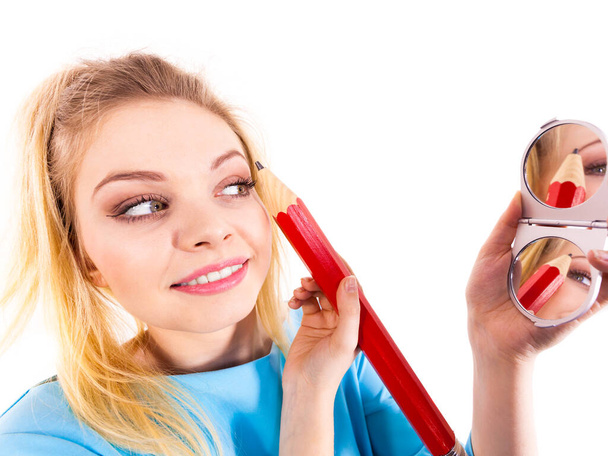 Woman painting eyebrows using regular pencil - Foto, Imagen