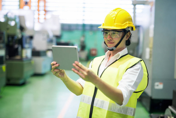 Inspector using tablet in manufactoring  factory - Photo, Image