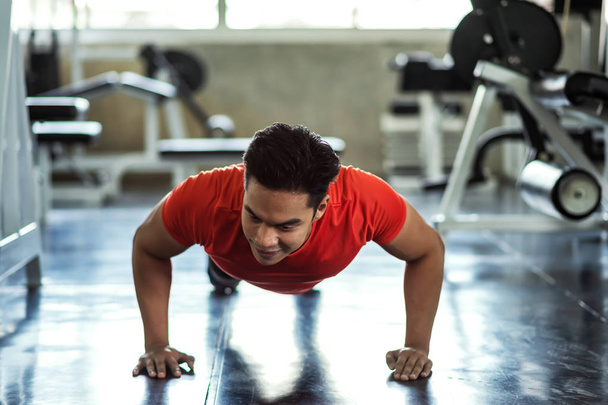 FItness man push up in gym - Fotó, kép