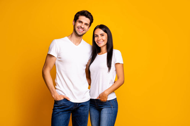 Photo of nice couple hugging ready for first working day reliable people wear casual clothes isolated yellow color background - Foto, immagini