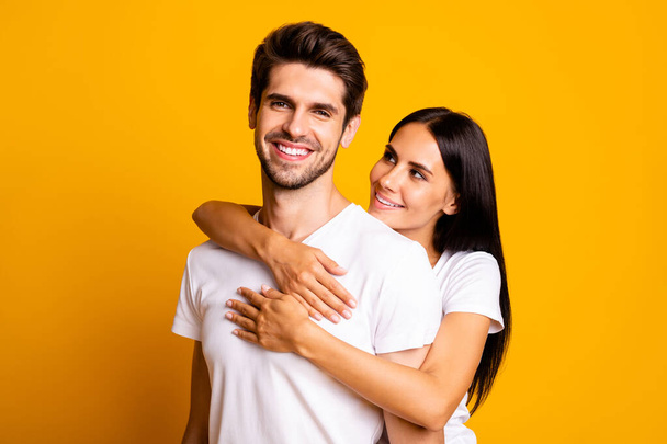 Photo of amazing pair in love piggyback pose missed each other happy to be finally together wear casual white t-shirts isolated yellow color background - Φωτογραφία, εικόνα