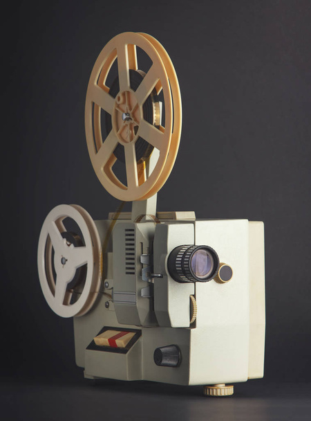Old cinema projector isolated on black background - Fotografie, Obrázek